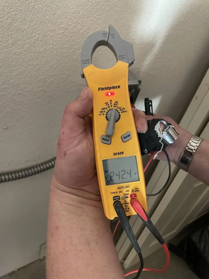 Voltage testing with clamp meter during Outlet Installation in Highfill
